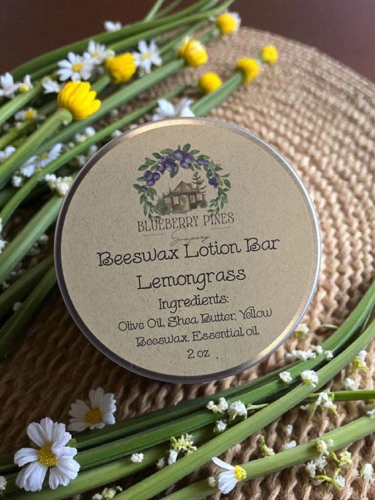 Beeswax lotion bar with lemongrass scent on a natural background with flowers