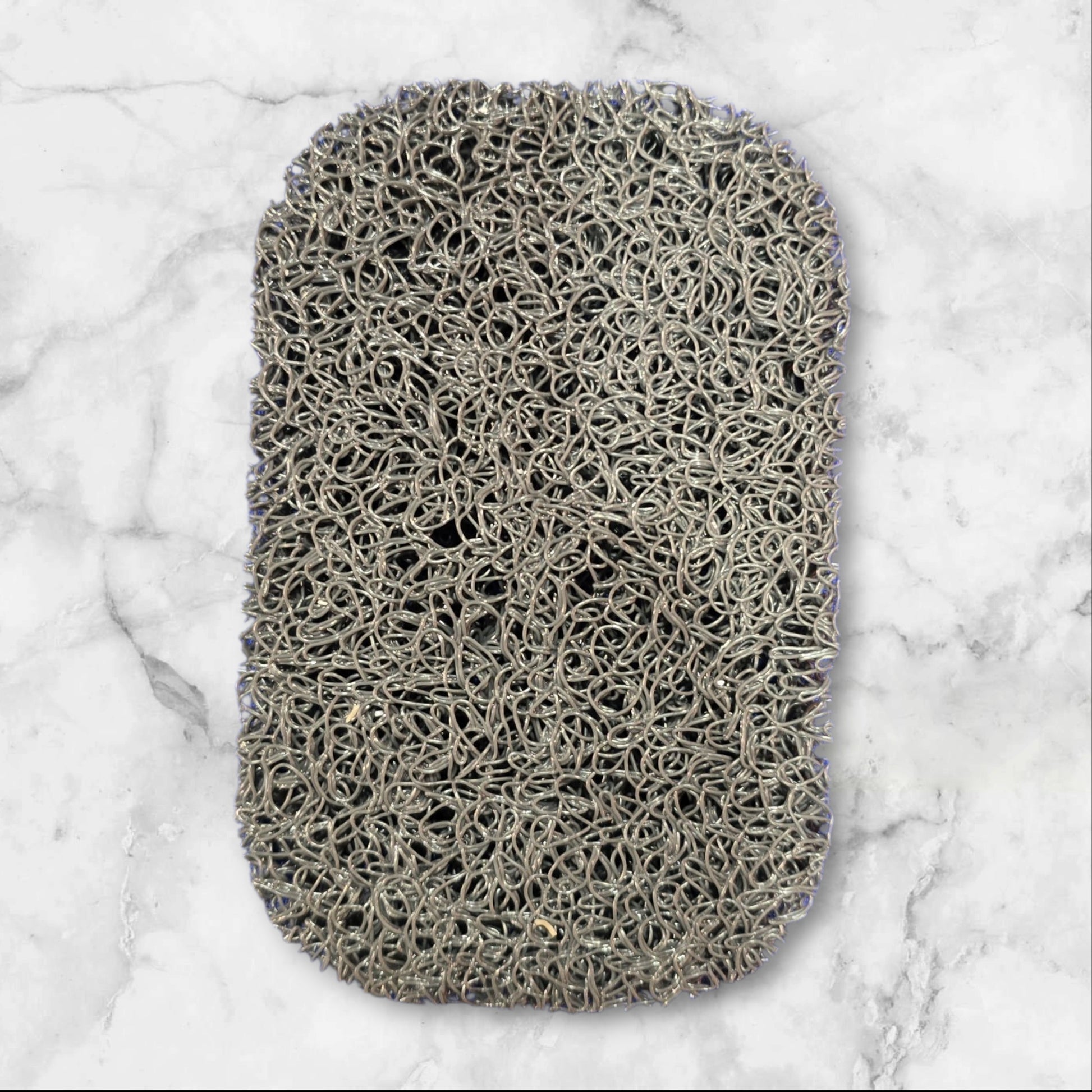 Non-slip self-draining soap bar holder pad that keeps bars dry, prevents slipping, and protects countertops.